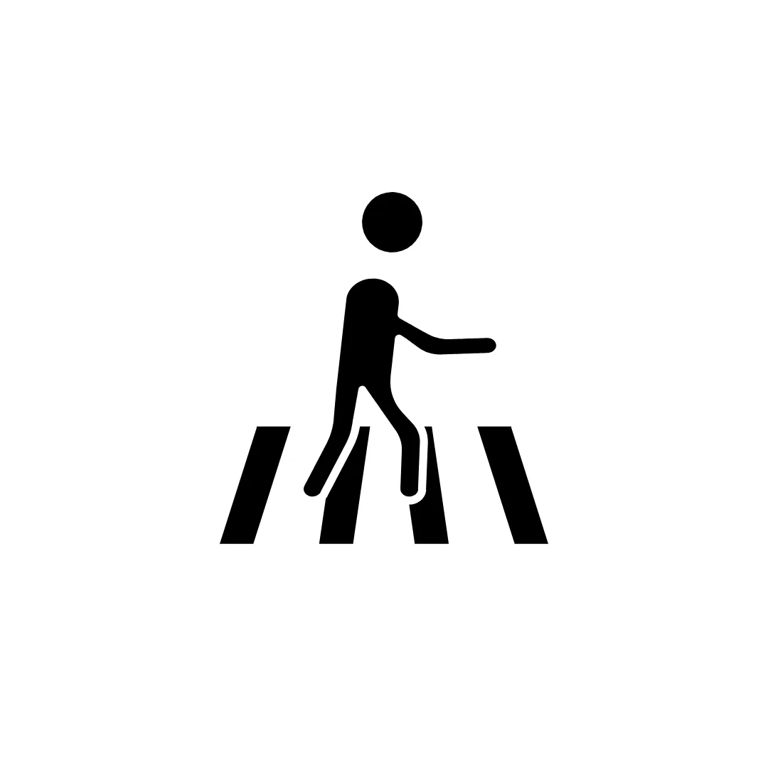 Pedestrian foot traffic crossing a channel drain grate in a walkway